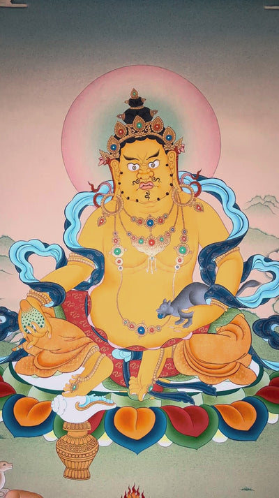 Yellow Zambhala thangka featuring the  Buddhist wealth deity seated on a lotus throne holding a mongoose