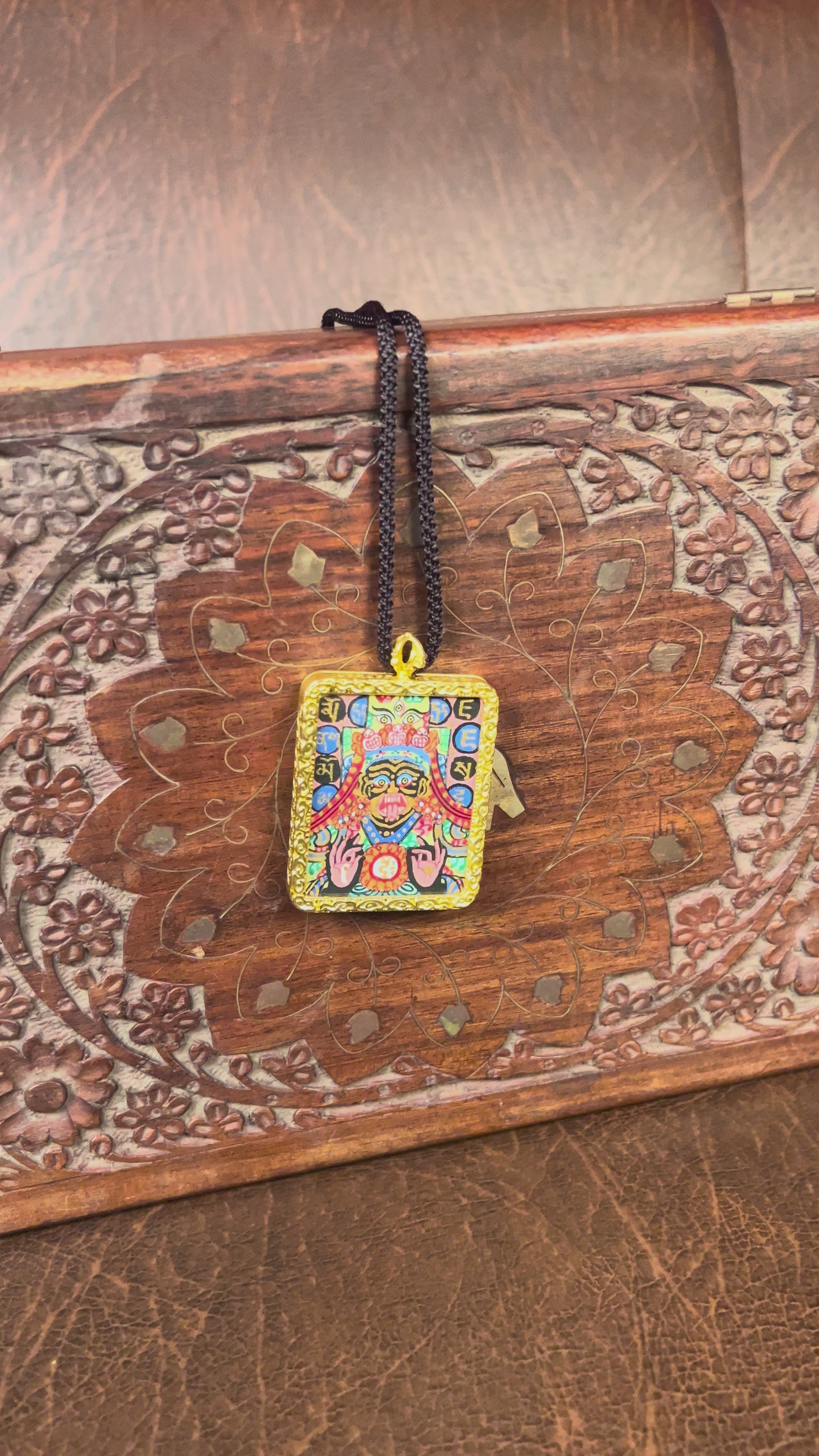 Hand-painted Goddess Kali miniature Thangka pendant in gold-accented copper Ghau locket with black cord.