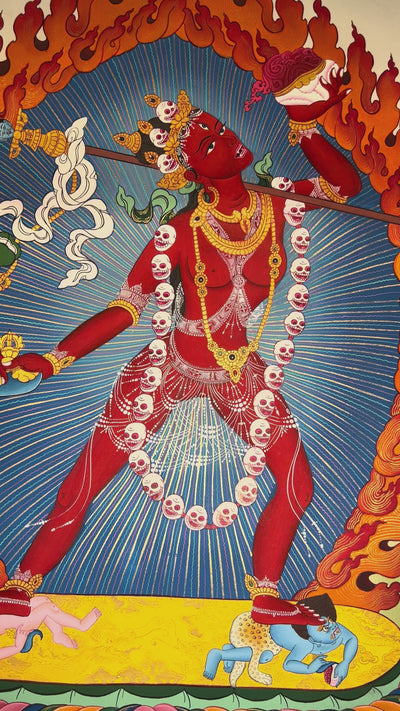 Vajrayogini thangka showing the red tantric dakini dancing with skull garland, holding kapala and ritual knife within a flaming aura.