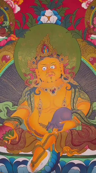 Yellow Zambhala Tibetan thangka featuring the Buddhist deity of wealth seated on a lotus throne with sacred gold detailing and prosperity symbolism