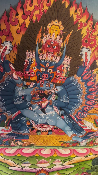 Yamantaka Thangka painting depicting the wrathful Buddhist deity surrounded by flames, symbolic figures, lotus petals and Himalayan landscape in traditional Tibetan Buddhist art from Nepal