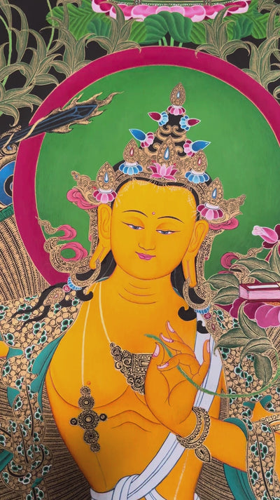 Hand-painted Manjushri Thangka depicting the Bodhisattva of Wisdom holding the Flaming Sword and Prajnaparamita Sutra with natural mineral pigments and gold detailing.