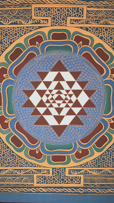 Hand-painted Shree Yantra lotus mandala featuring sacred geometric triangles within an ornate Tantric decorative border