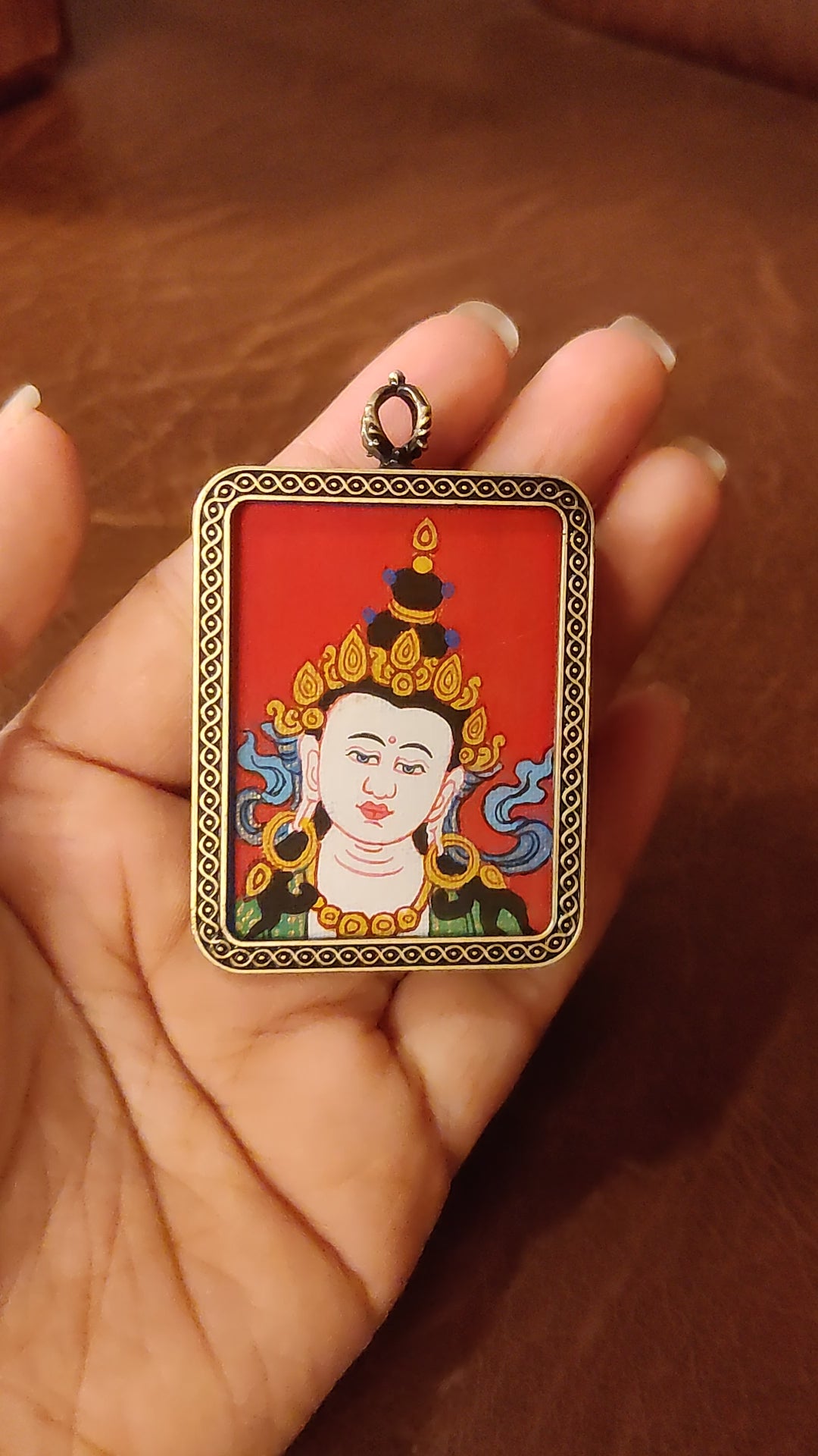 Vajrasattva Ghau pendant in an antique-style metal frame featuring a miniature Tibetan Buddhist painting handcrafted in Nepal.