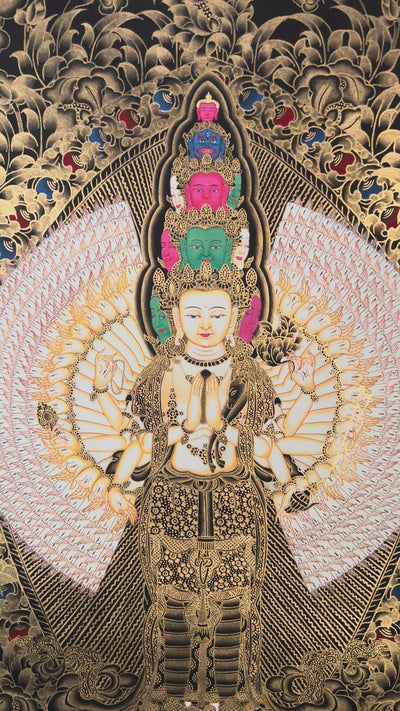 Hand-painted Thousand-Armed Avalokiteshvara thangka in gold on black background showing eleven-faced Chenrezig with multiple arms standing on lotus pedestal.