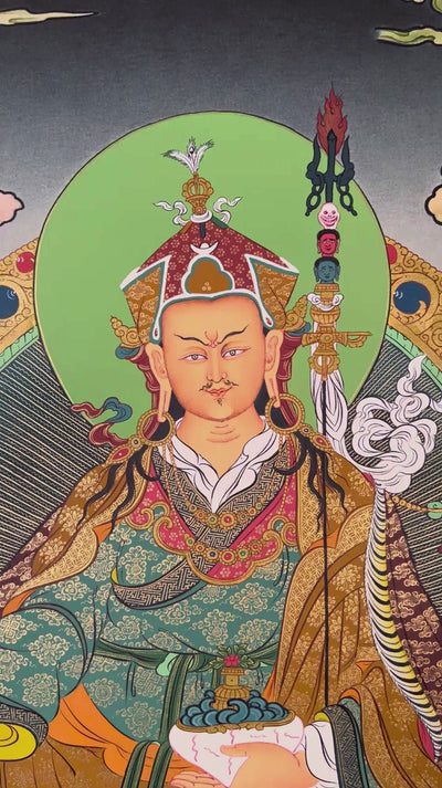 Guru Rinpoche thangka featuring Padmasambhava seated on a lotus throne holding vajra and skull cup surrounded by Buddhist deities and Himalayan scenery
